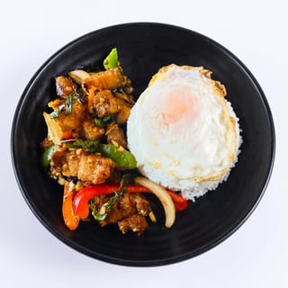 Crispy pork belly Kra pow over rice w/fried egg